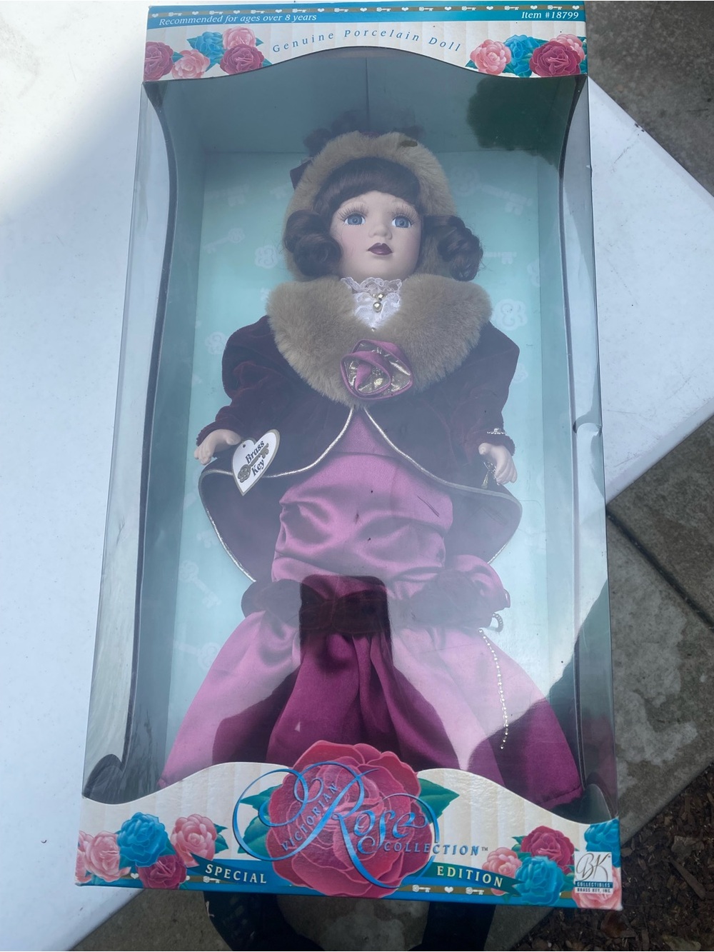 Porcelain Holiday Doll in Burgundy Velvet and Pink Satin